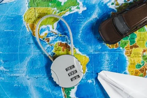 Code Lock, Toy Car, Papercraft Plane on World Map Background. Concept-Ban on 스톡 사진