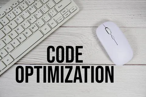 Code Optimization text with keyboard and wireless mouse on wooden background 스톡 사진