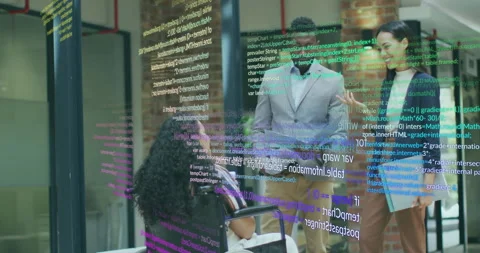 Code overlay appearing as wheelchair user gesturing while tech team tapping Stock Footage 315563021