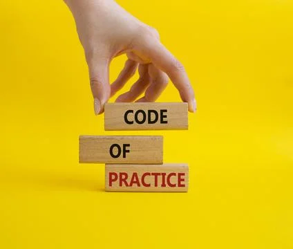 Code of Practice symbol. Concept word Code of Practice on wooden blocks. Busi 库存照片