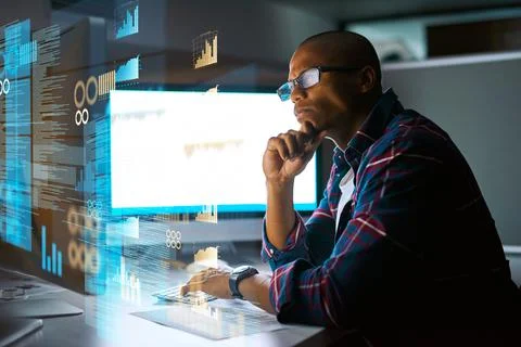 The code requires thought. a young male programmer working on computer code in Stock Photos