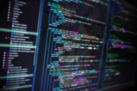 Code on screen blurry background image Stock Photos