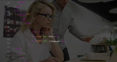 Code scrolling sparking woman taking cybersecurity notes while man reviewing Stockbeeldmateriaal 315800612