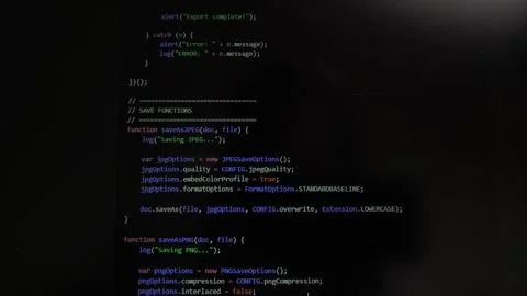 Code scrolls on computer screen showing programming process in dark mode. D.. Stock Footage 337774089