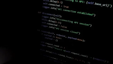 Code scrolls on screen with vignette effect in dark environment. Programmin.. Stock Footage 333143519