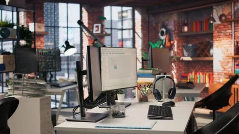 Code testing and quality assurance done on computers in startup workplace Stock Photos