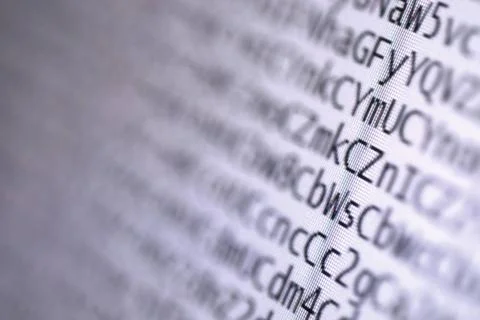 Coded digital letters background macro on tft monitor coded digital letter... Stock Photos