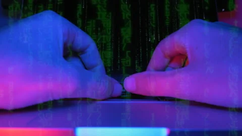 Coder hacker is testing virus security system in dark working room. Male Stock Footage 141699030