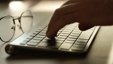 A coder hands are typing on pc keyboard. Businessman is working in office Stock Footage 160826708