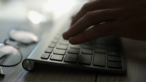 A coder hands are typing on pc keyboard. Businessman is working in office Stock Footage 162043386