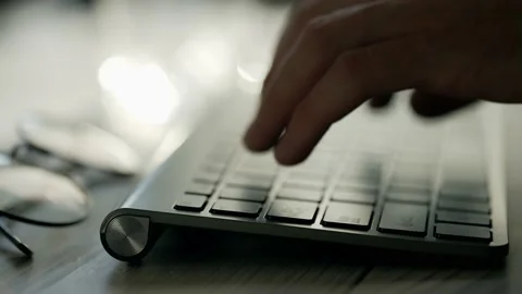 A coder hands are typing on pc keyboard. Businessman is working in office Stock Footage 164528248