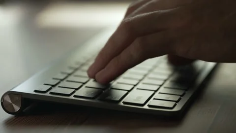 A coder hands are typing on pc keyboard. Businessman is working in office Stock Footage 167952232