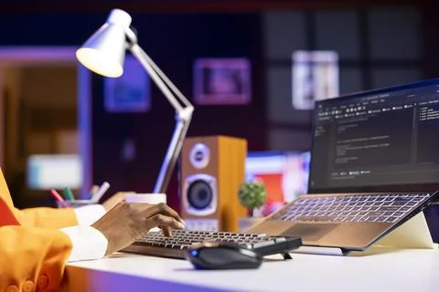 Coder at laptop programming, writing lines of code, close up 스톡 사진