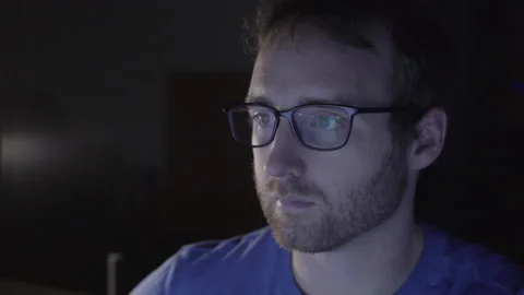 Coder Looking at Multiple Screens Stock Footage 208745915