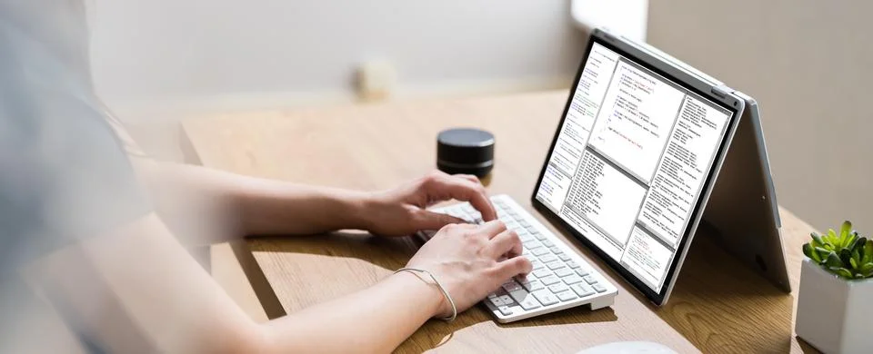 Coder Or Software Developer Using Laptop Screen 库存照片