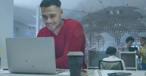 Coder in red scanning code starting world map overlay for business insight while Stock Footage 327848201