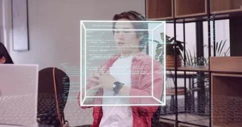 Coder stretching activating 3D code cube manipulating using smartwatch before Stock Footage 315508447