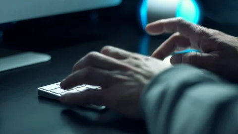 Coder typing code in python language using wireless computer keyboard Stock Footage 118801120