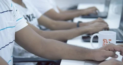 Coder typing on laptop numbers on screen Stock Footage 155958473