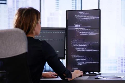 Coder Using Computer At Desk 写真素材