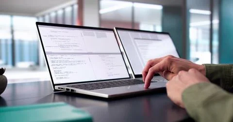 Coder Using Computer At Desk 스톡 사진