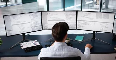 Coder Using Computer At Desk 스톡 사진