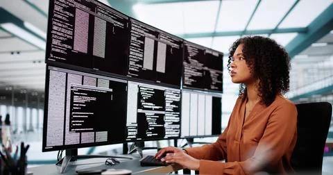 Coder Using Computer At Desk Stock Photos