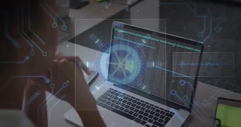 Coder using trackpad and activating HUD, hologram growing and pulsing over code Stock Footage 331701099