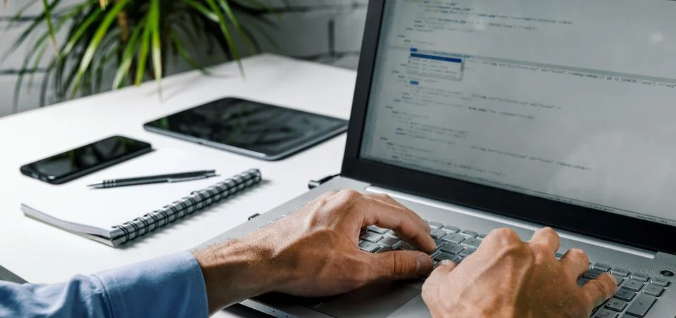 Coder web developer write code on laptop computer. website programming, softw Stock Photos