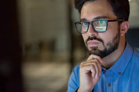 Coder working with ai software development solutions. Code glasses reflections. Stock Photos