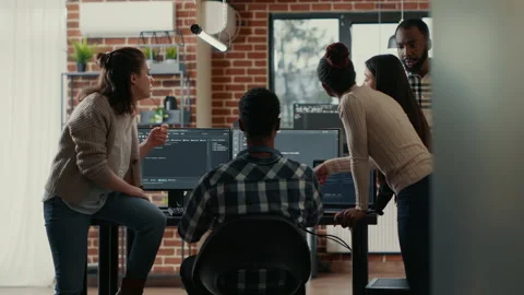 Coders discussing about source code compiling discovers errors and asks the rest Stock Footage 168241384