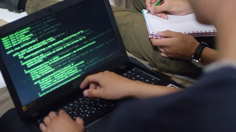 Codes Displayed on Laptop Computer Screen Stock Footage 99471498