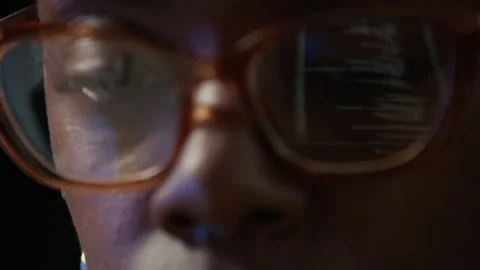Codes on Laptop Screen Reflecting on Eyeglasses of Black Female Developer Stock Footage 319992813
