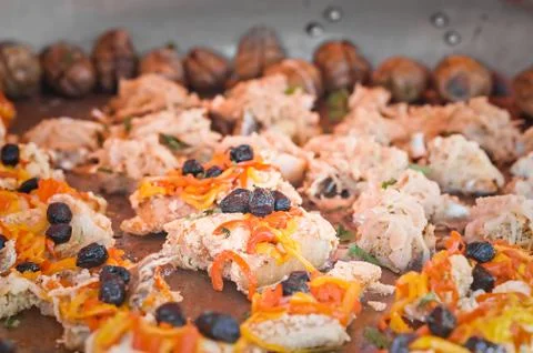 Codfish in baking with peppers and olives. Stock Photos
