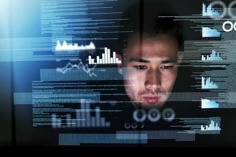 Coding all night long. Shot of a focussed computer programmer working at his  写真素材