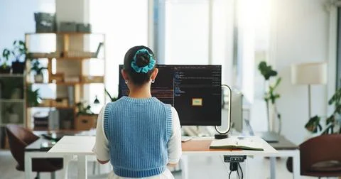 Coding, back or woman in office with desktop, system update or testing in s.. Foto stock