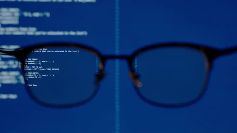 Coding on blue screen computer system thru eye glasses insight vision in data Video stock 142726999