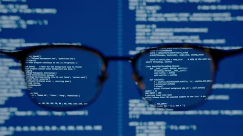 Coding on blue screen computer system thru eye glasses insight vision in data Stock-Footage 142727081