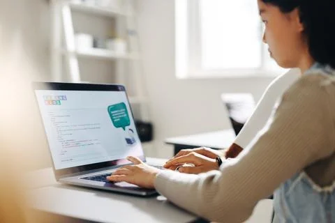 Coding for children: Young girl programmes with a laptop in a computer scie.. Stock Photos