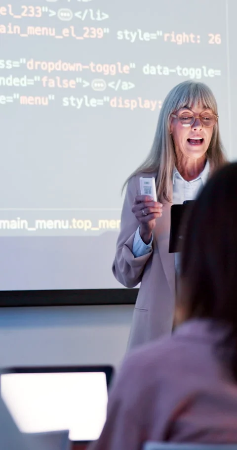 Coding, class and teacher at academy with mature woman, speaker and programming Stock Footage 286403684