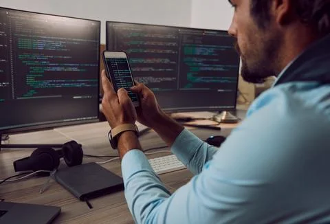 Coding, computer screen and phone with man, programmer and software update Stock Photos