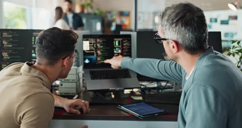 Coding, computer screen and pointing with business people in office together Stock Footage 290057665