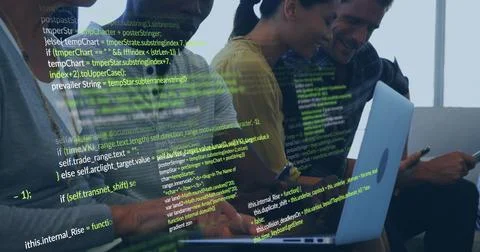 Coding dev team leaning toward laptops at bench by window, yellow top, Apple 写真素材