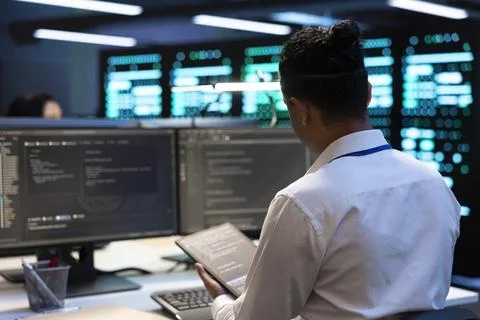 Coding, developer and tablet in data center for systems diagnostics Stock Photos