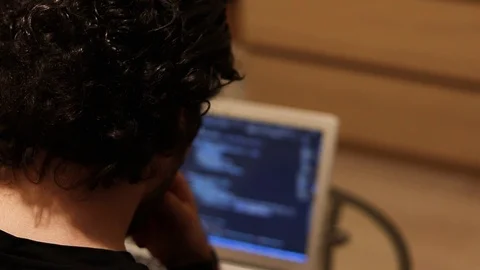 Coding developer trying to find solution about his problem in code. Insight Stock Footage 121581635