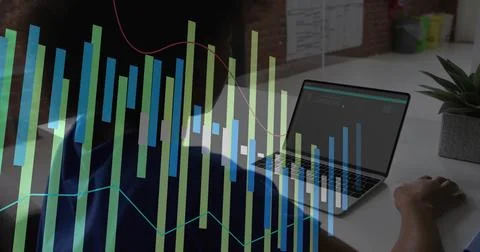 Coding female developer analyzing metrics on laptop at office desk, with data Stock Photos