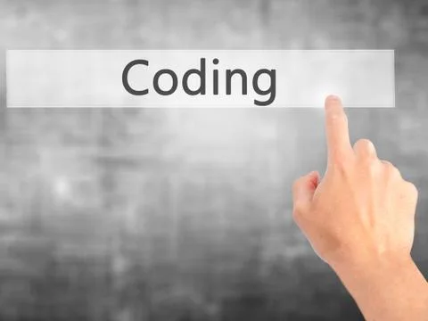 Coding - Hand pressing a button on blurred background concept on visual scree Stockfoto's