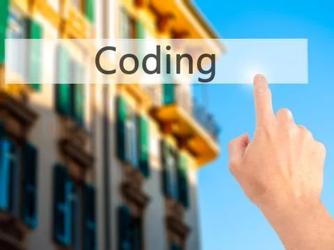 Coding - Hand pressing a button on blurred background concept on visual scree Stockfoto's