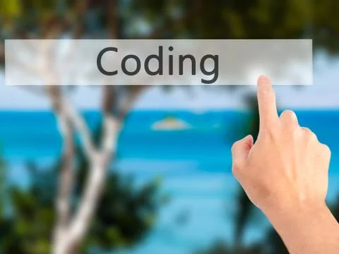 Coding - Hand pressing a button on blurred background concept on visual scree Stockfoto's