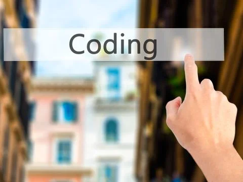 Coding - Hand pressing a button on blurred background concept on visual scree Stockfoto's